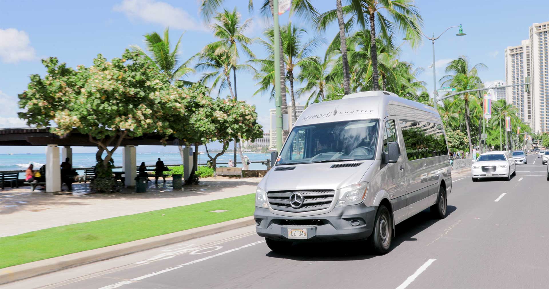 shuttle van driving along the seaside